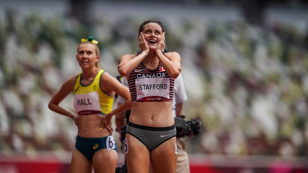 Lucia Stafford smiles and holds her head in disbelief