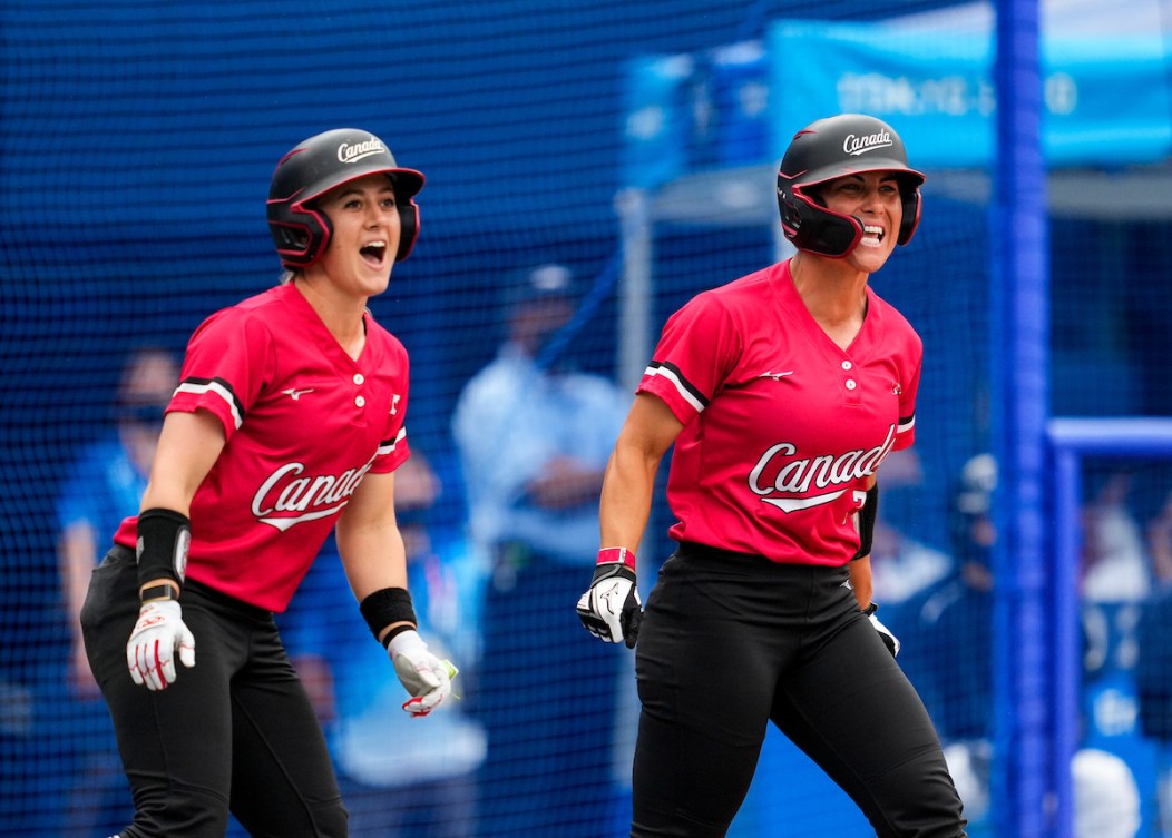 Erika Polidori and Jennifer Salling celebrate scoring against Mexico