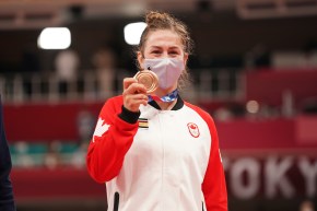 Christine Beauchemin-Pinard shows her Olympic bronze medal