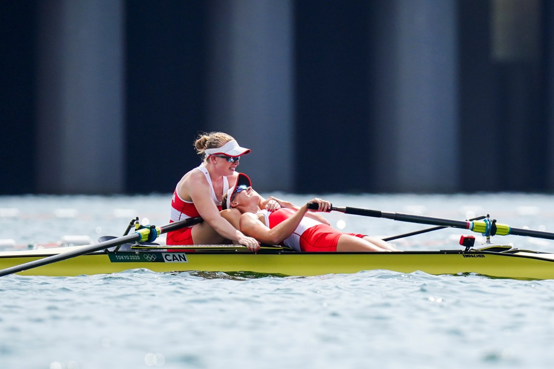 Hillary Janssens collapses on partner Caileigh Filmer after their rowing bronze 