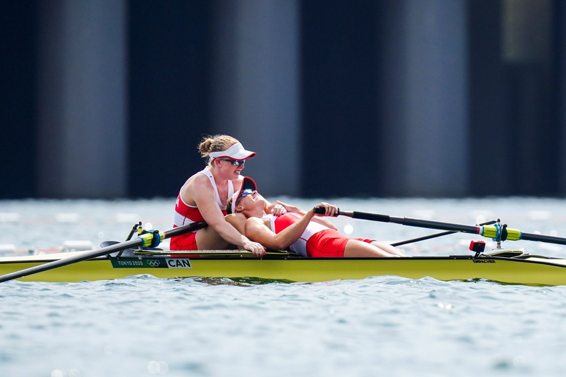 Hillary Janssens collapses on partner Caileigh Filmer after their rowing bronze