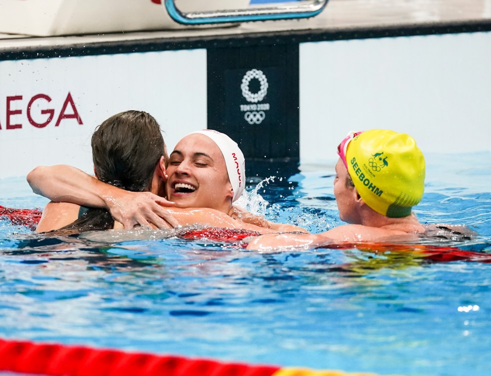 Kylie Masse hugs a competitor after finishing the race