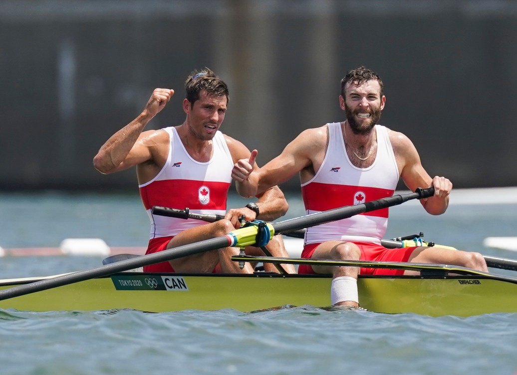 Two rowers celebrate in their boat