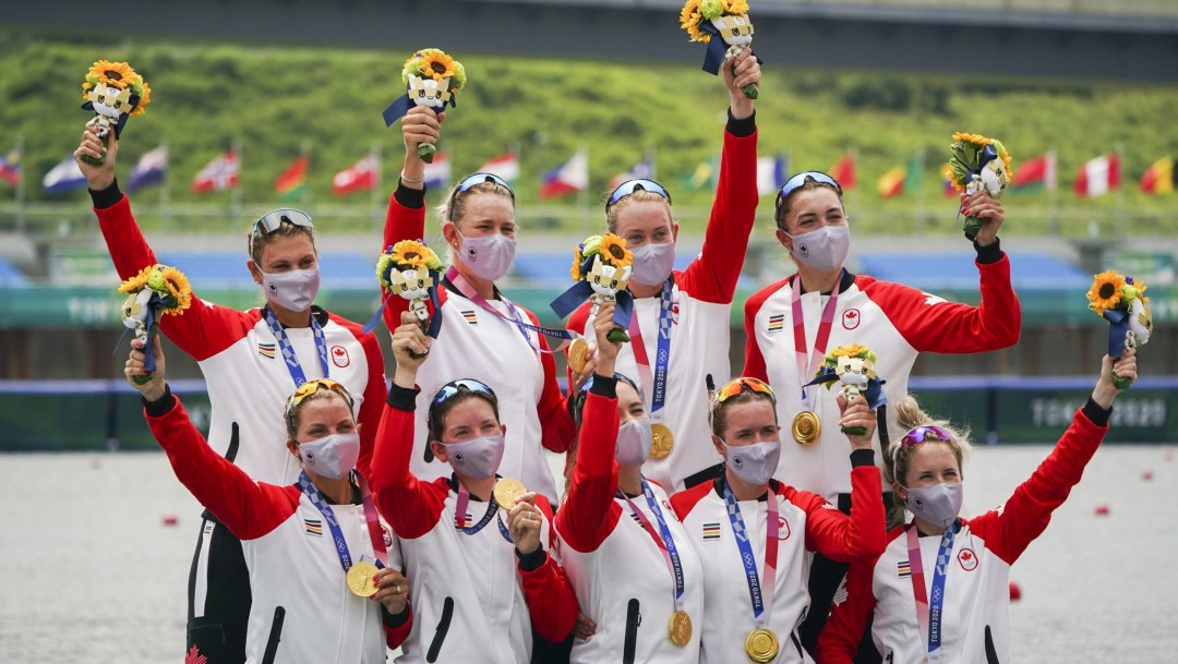 Canadian rowing eight women's team wear their medals