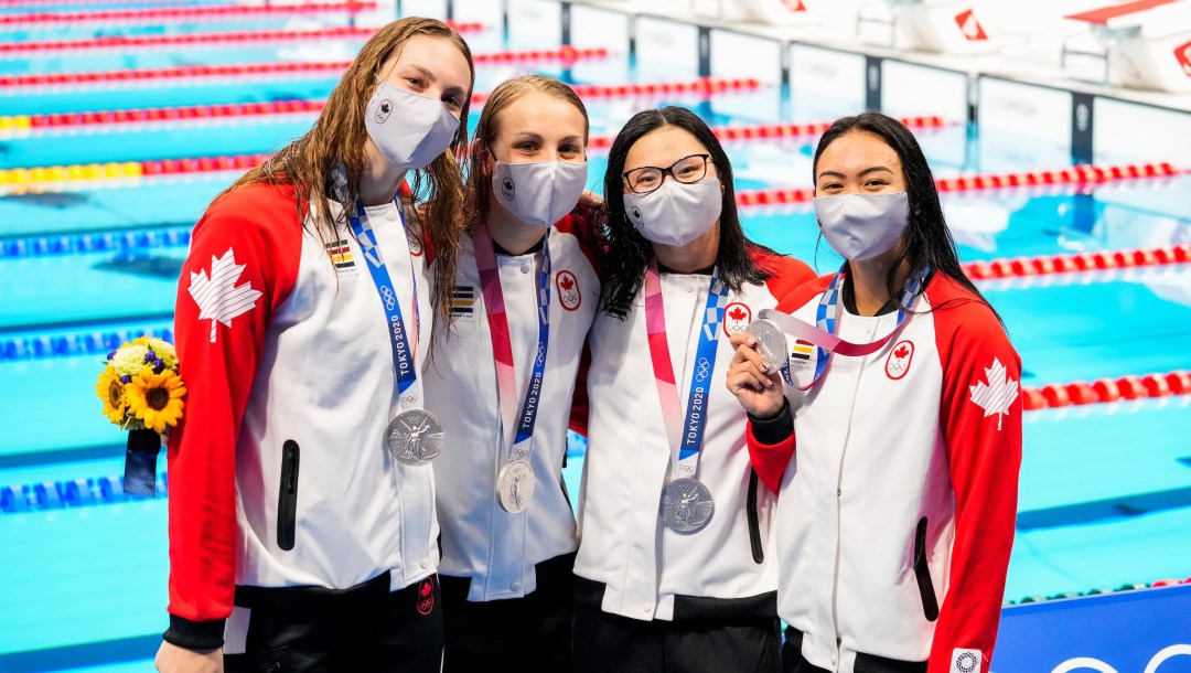 Canadian swimmers pose with silver medals