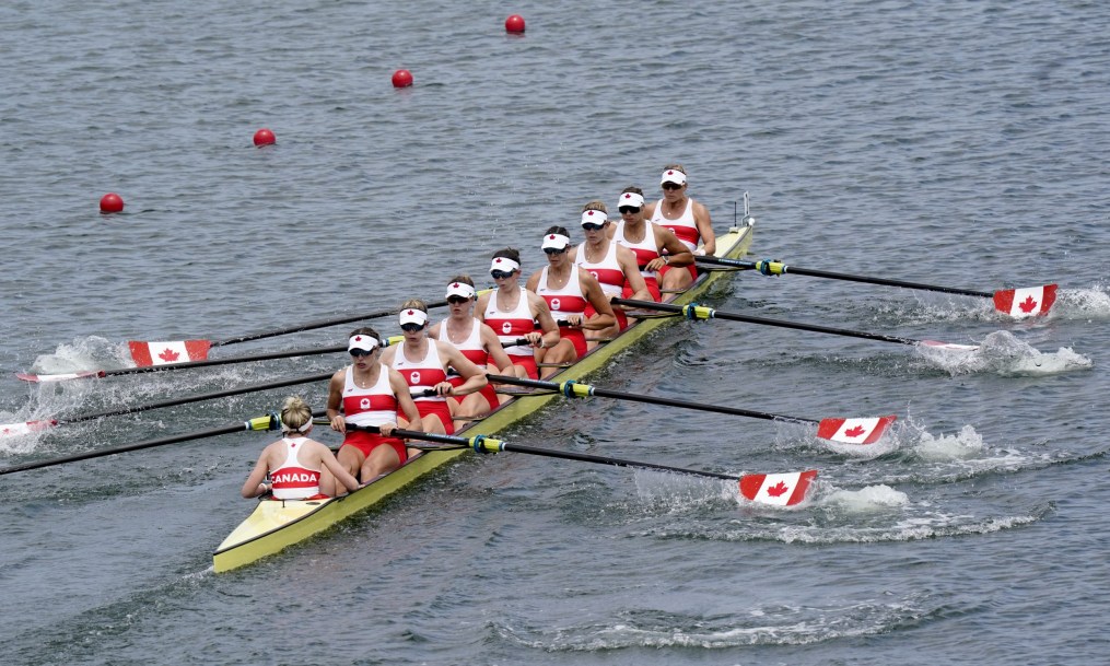 Wide photo of the Canadian women's eight rowing crew in race action