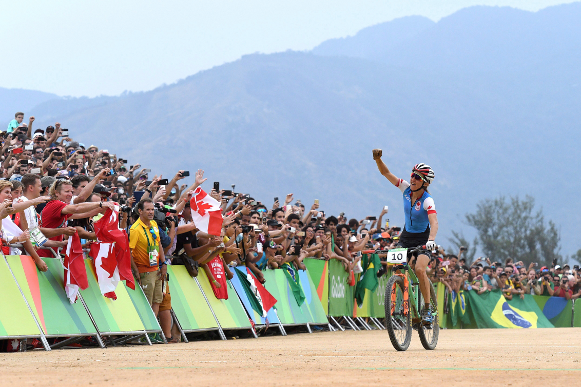 cyclist crosses finish line