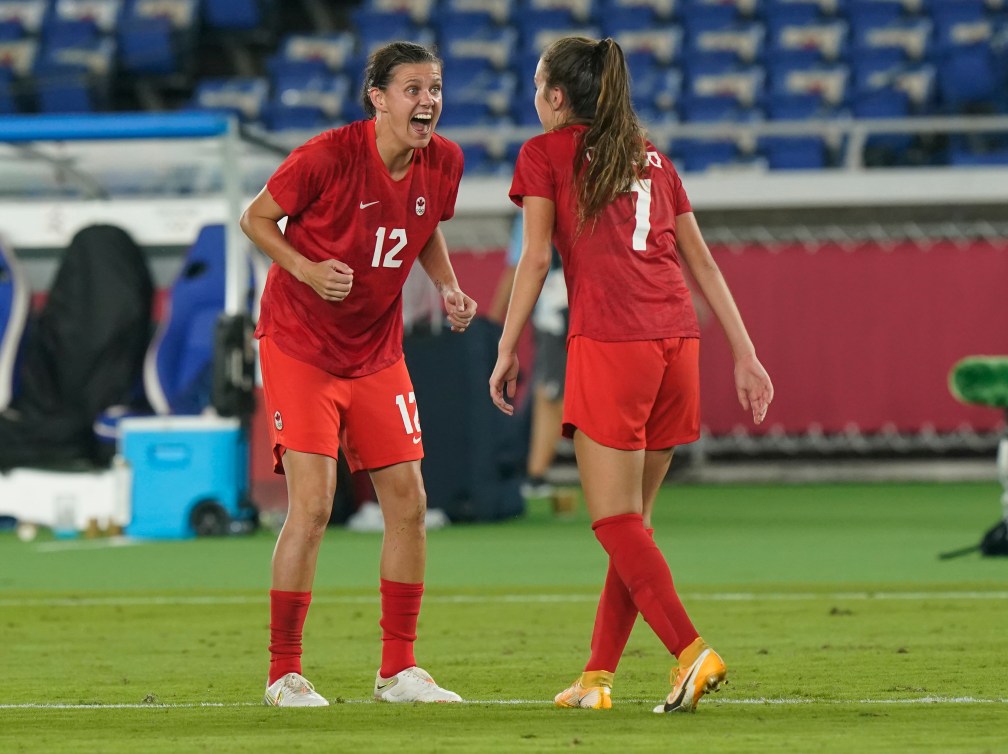 Christine Sinclair and Julia Grosso celebrate after the game