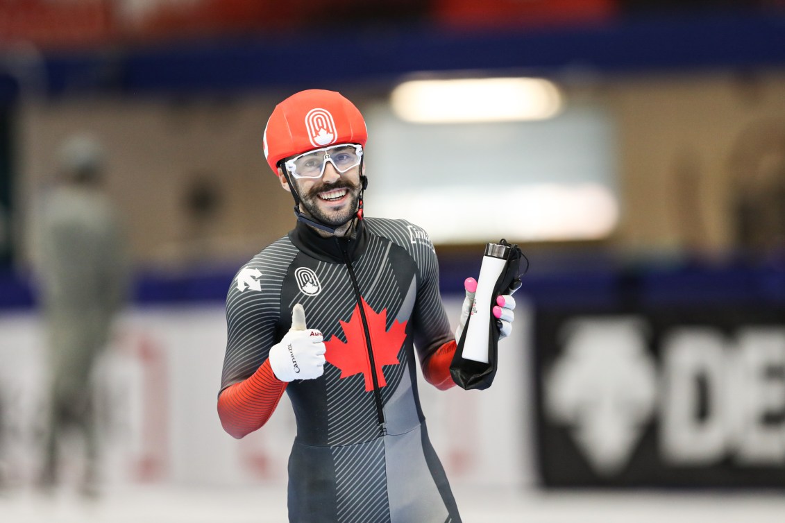 Steven Dubois gives a thumbs up while holding onto his water bottle.