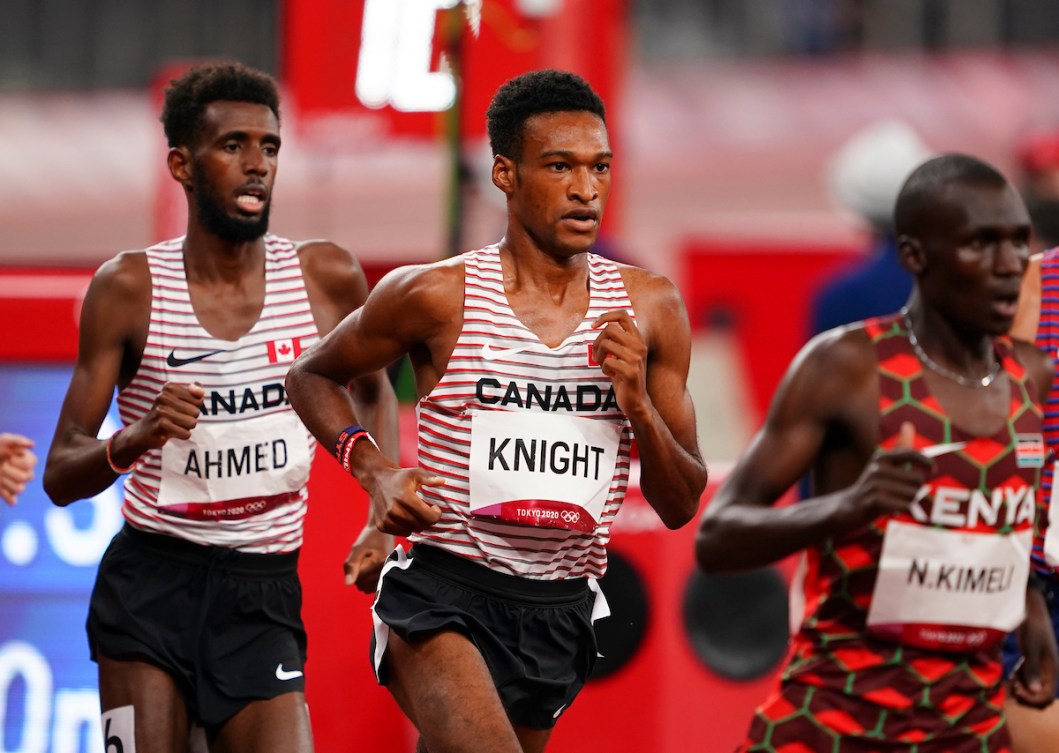 Justyn Knight in the 5000m race, with Mohammed Ahmed right behind him