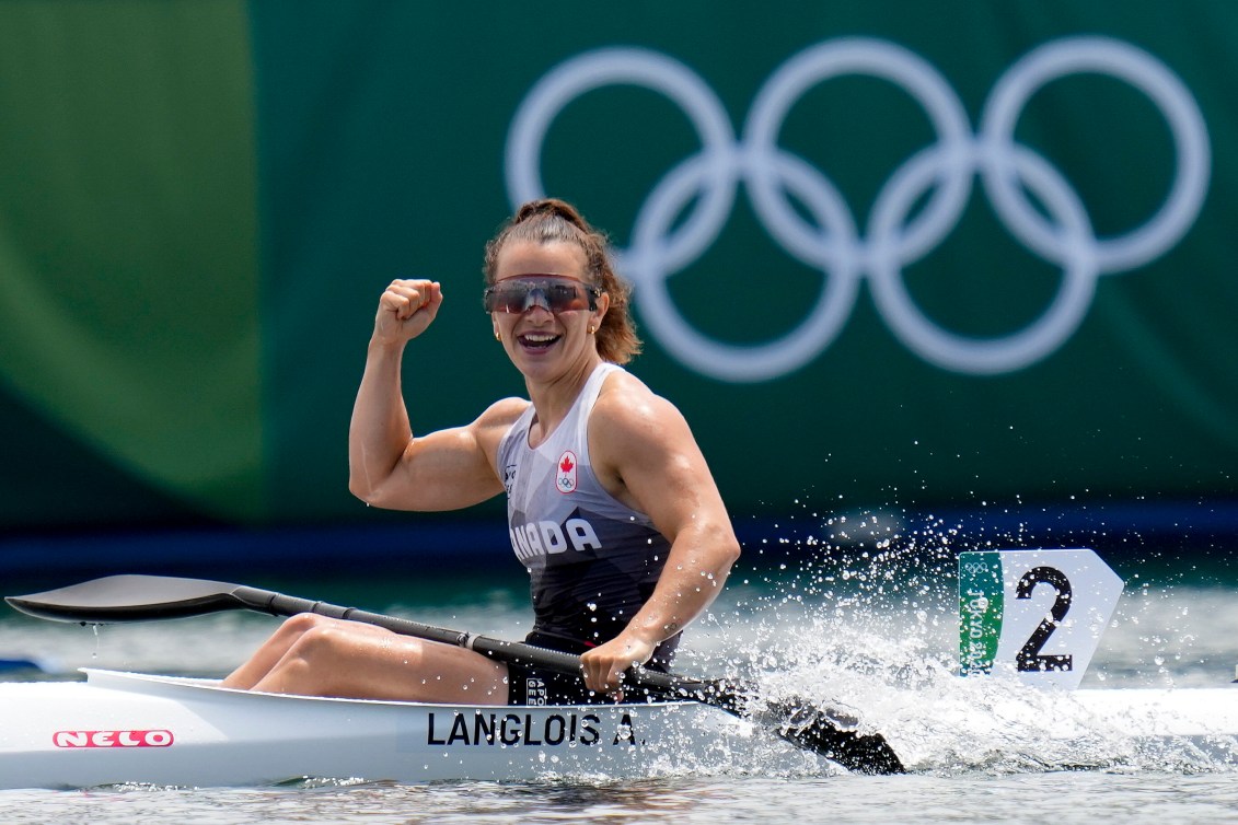 Andreanne Langlois raises her fist in celebration 