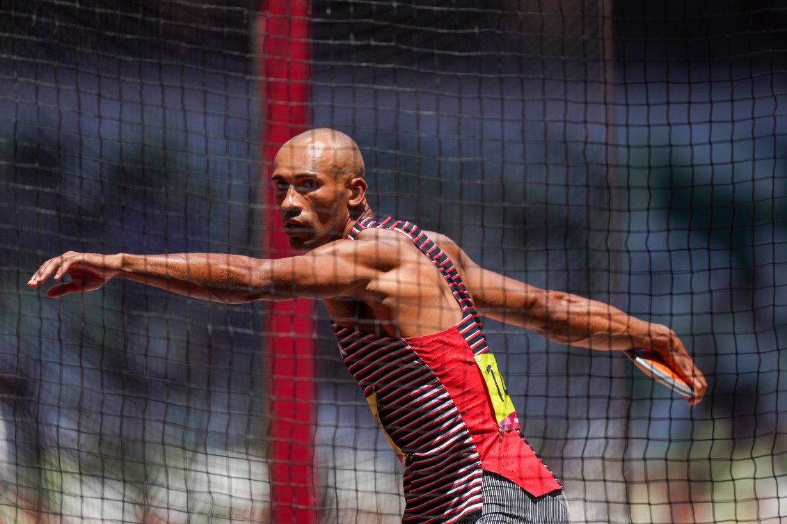 Damian Warner spins to throw the discus 