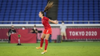 Julia Grosso jumps in celebration after scoring her gold medal winning goal in soccer