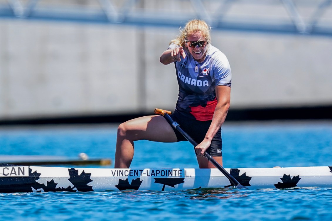 Laurence Vincent Lapointe points in celebration after her silver medal