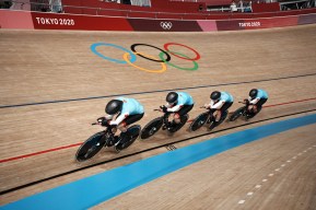 Four cyclists in a line racing in a team pursuit