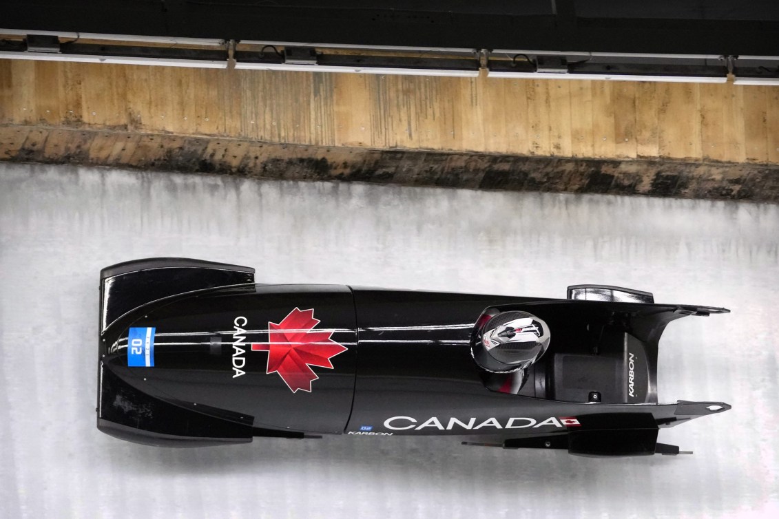 Women's monobob going through the curve of a track