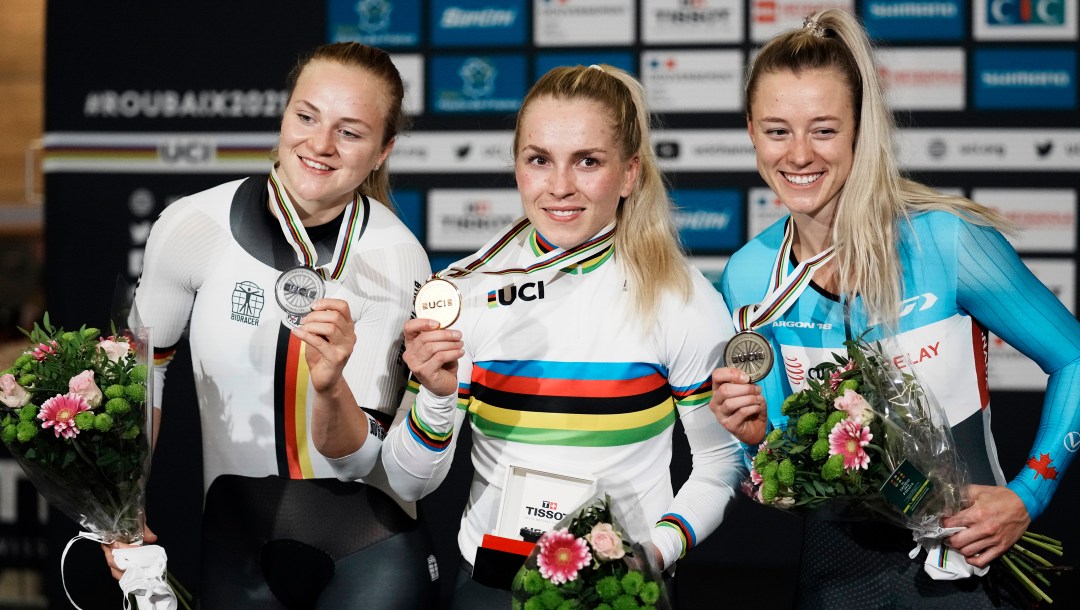 Kelsey Mitchell (right) on the podium with the two other women's sprint medallists