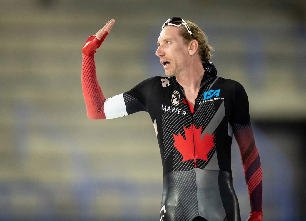 Ted-Jan Bloemen waves after winning a speed skating race 