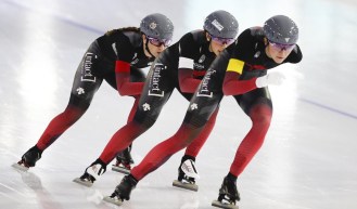 Team Canada with Valerie Maltais, center, Ivanie Blondin, left, and Isabelle Weidemann, right, compete during the women's team pursuit race of the World Cup Speedskating at the Thialf ice arena in Heerenveen, northern Netherlands, Friday, Jan. 22, 2021. (AP Photo/Peter Dejong)