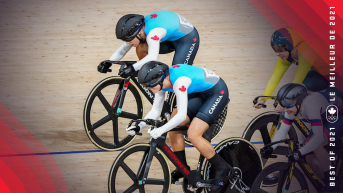 Two Canadian cyclers emerge from the pack on the indoor track.