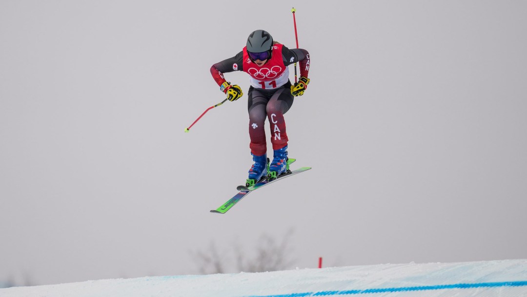 Courtney Hoffos prepares to land a jump on a ski cross course