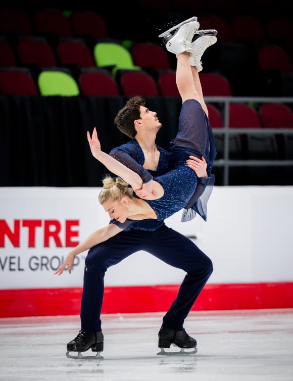 Paul Poirier holds Piper Gilles in a dance lift