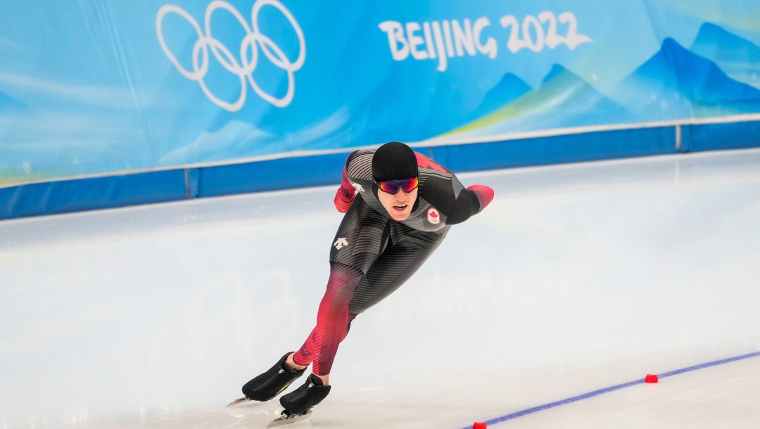 Graeme Fish skates around a bend in a speed skating race