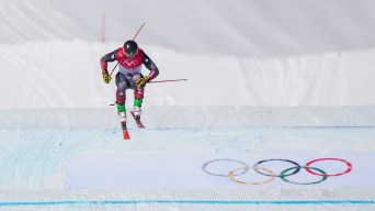 Reece Howden prepares to land a jump on a ski cross course