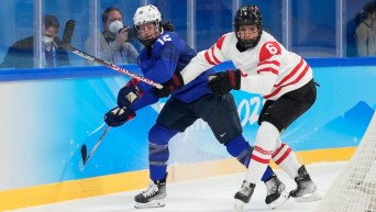 Rebecca Johnston #6 of Team Canada battles against Kelly Pannek #12 of Team United States