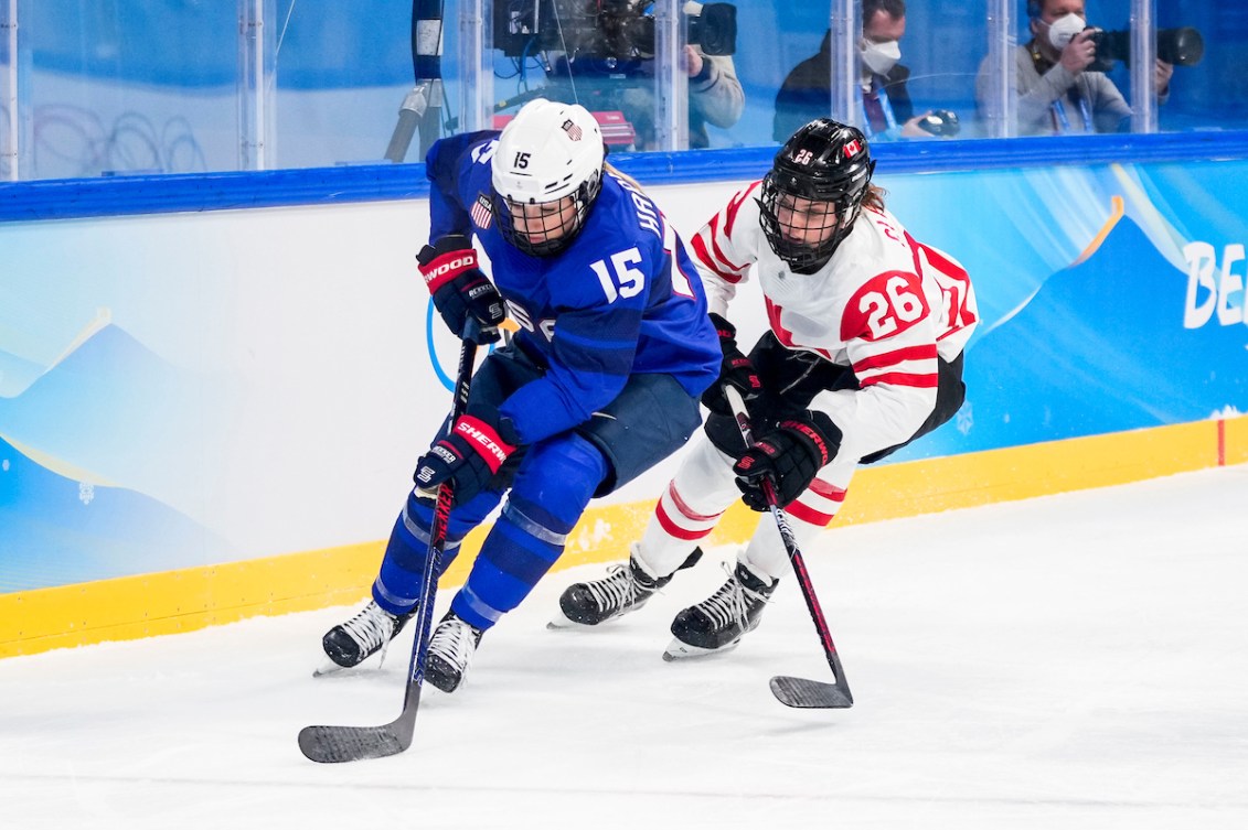 Emily Clark #26 of Team Canada battles against Savannah Harmon #15 of Team United States