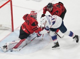 Team Canada goaltender Eddie Pasquale (80) makes a save