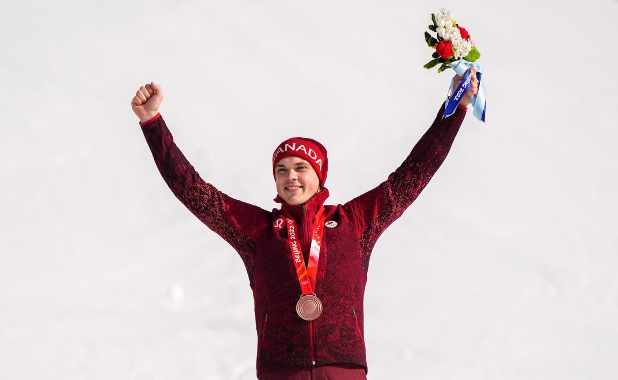 Jack Crawford holds arms in the air after getting his bronze medal