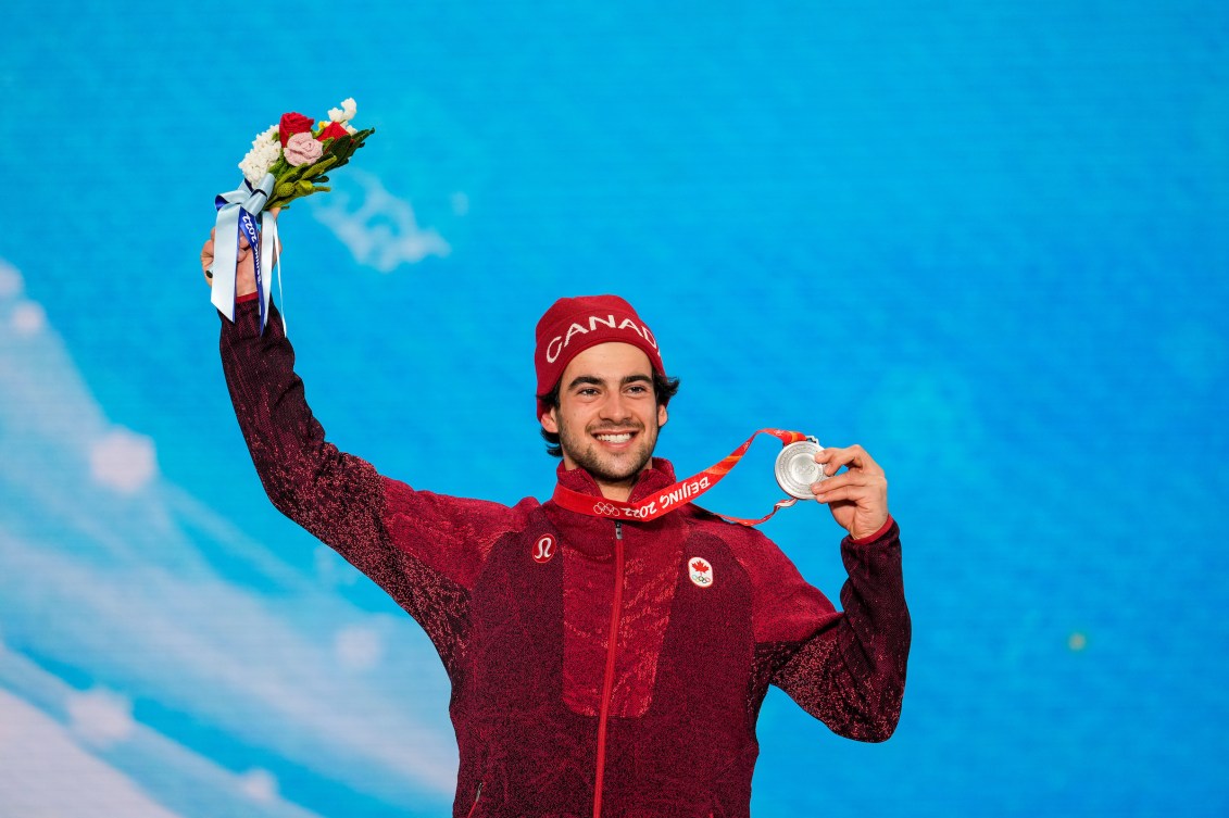 Eliot Grondin holds up his silver medal on the podium