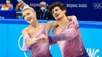 Piper Gilles and Paul Poirier skate in dance hold