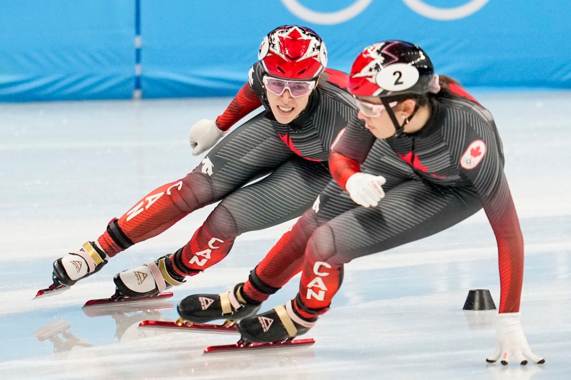 Florence Brunelle and Kim Boutin skate around the track