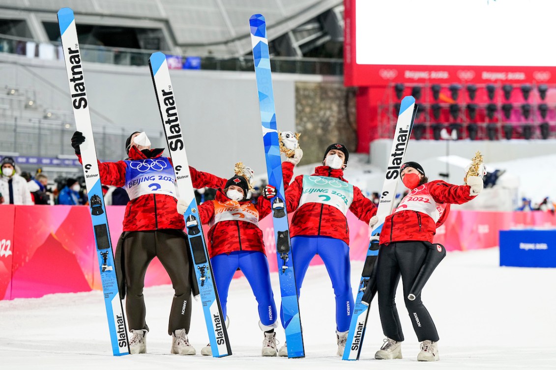 Four ski jumpers celebrate