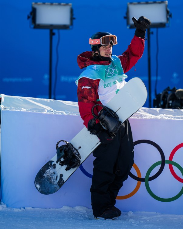 Mark McMorris raises his fist in happy reaction to his score