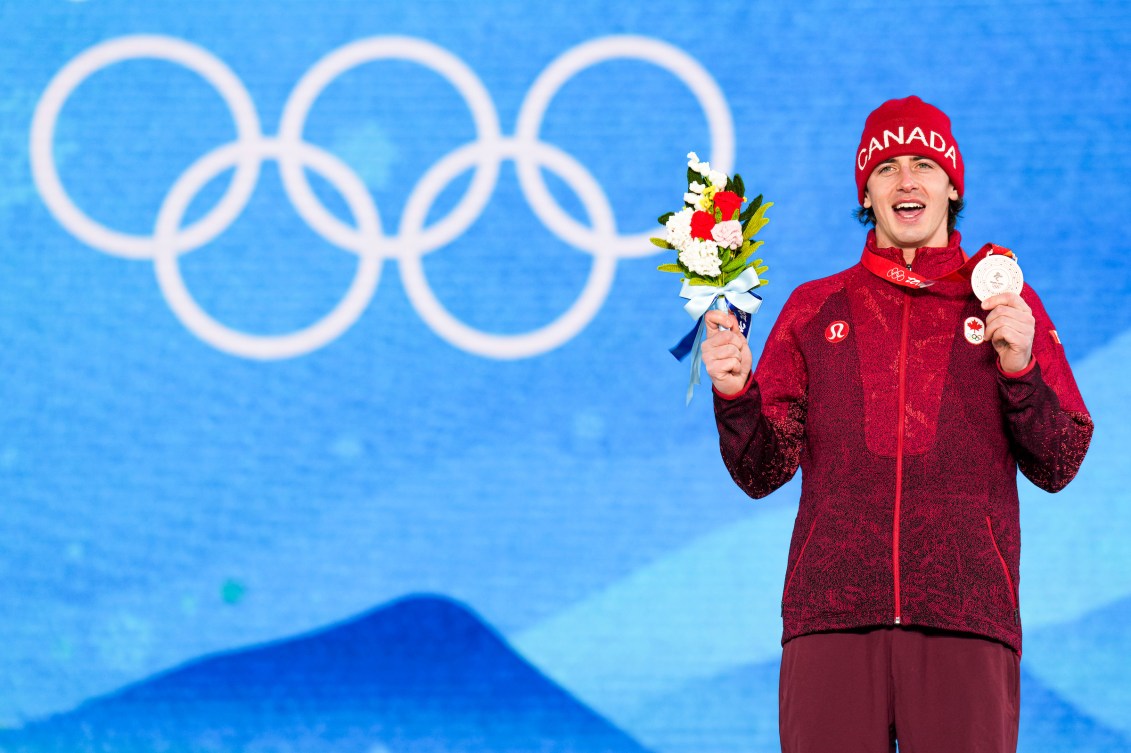 Mark McMorris holds up his bronze medal on the podium at Beijing 2022