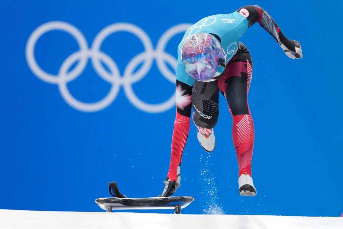 Mirela Rahneva does a running start with her skeleton sled  