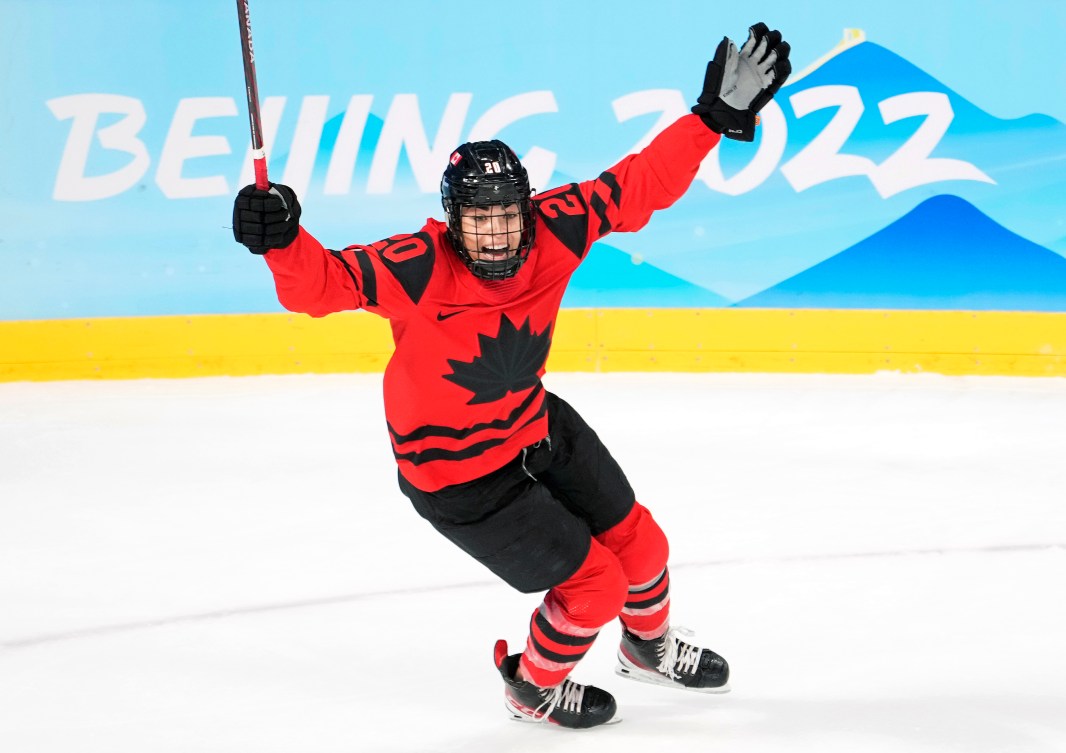 Sarah Nurse raises her arms to celebrate a goal