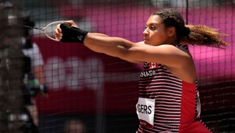 A member of Team Canada spins during a hammer throw competition
