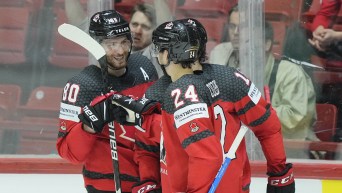 Canada's Pierre-Luc Dubois, left, celebrates his goal with Canada's Dylan Cozens, right, during the group A Hockey World Championship match between Canada and France in Helsinki, Finland, Tuesday May 24 2022. (AP Photo/Martin Meissner)