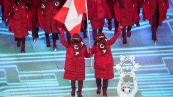 Two flag bearers holding the flag.