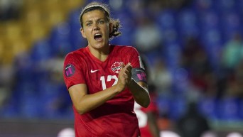 Christine Sinclair reacts on the field