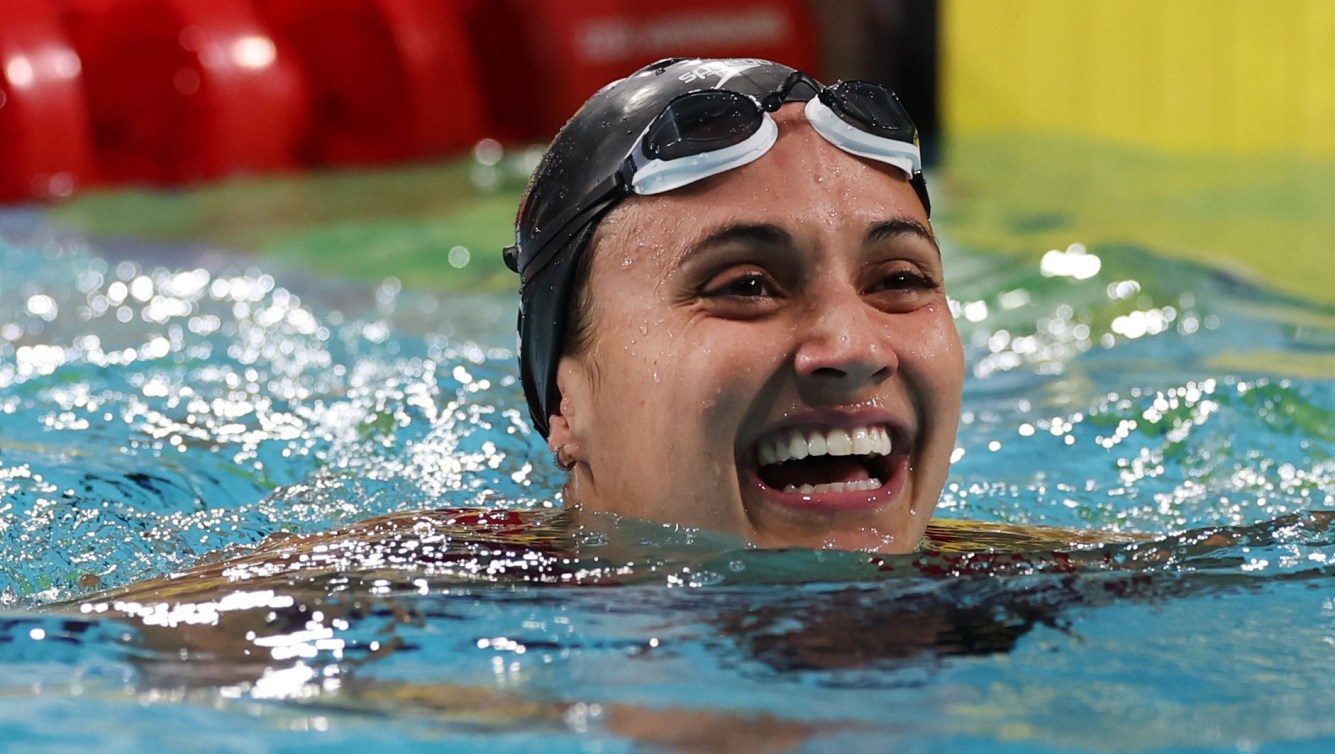 Kylie Masse smiles big after finishing a race