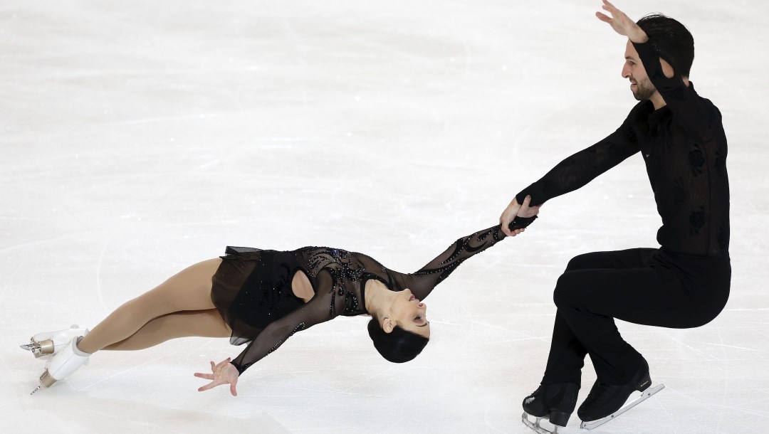 Deanna Stellato-Dudek and Maxime Deschamps perform in the pairs short program during the Grand Prix Skate America Series, Friday, Oct. 21, 2022, in Norwood, Mass. (AP Photo/Michael Dwyer)
