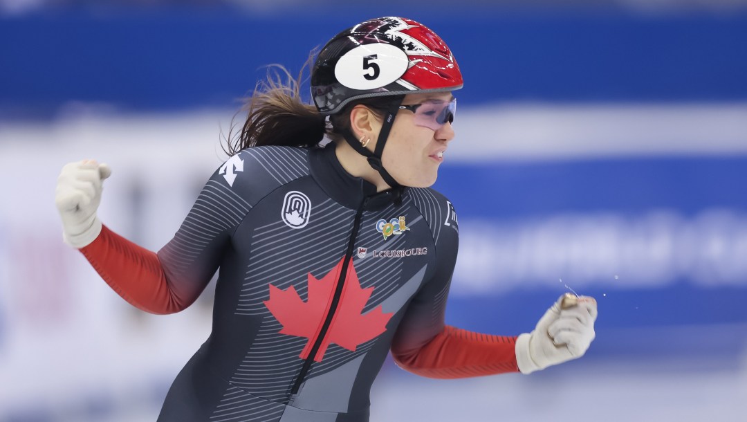 Courtney Sarault pumps her fists in celebration