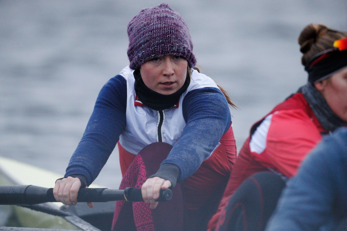 Caileigh Filmer wears a toque while rowing in training on a cold lake
