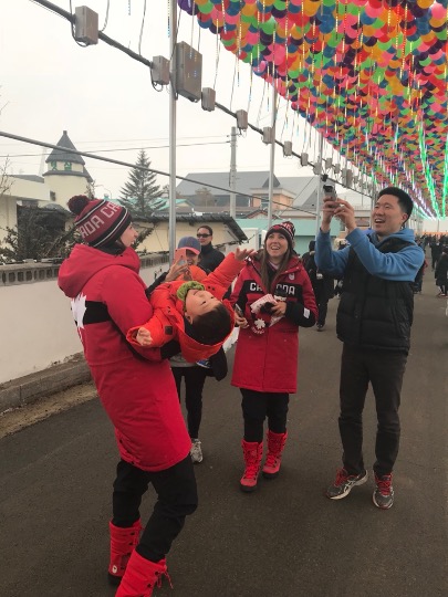 Lisa Weagle holds a Korean child in her arms