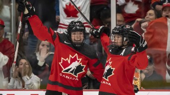 Team Canada's Claire Thompson and Blayre Turnbull celebrate a goal against Sweden at the 2023 IIHF Women's World Championship.